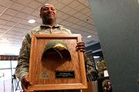 Army Staff Sgt. Thalamus Lewis received the helmet that saved his life in Afghanistan at an April 19 ceremony at Fort Belvoir, Va. The enemy rifle round struck the right side of his Advanced Combat Helmet and blew out the front. Matthew Cox/Military.com