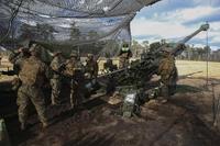 Marines with 1st Battalion, 10th Marine Regiment prepare to load an M777A2 howitzer during a fire mission during a training exercise at Camp Lejeune, N.C., Feb. 9, 2016. (U.S. Marine Corps/ Cpl. Sullivan Laramie)