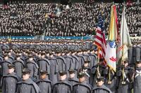 The Cadets and Midshipmen march onto the field in the annual tradition ahead of the Army-Navy game. (DoD photo)