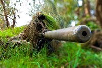 Two Soldiers pursue a closer observational vantage point to sight their target during a training exercise at a Forward Observation Base in Nothern Mosul, Iraq, Feb. 15. (Spc. Gregory Gieske)