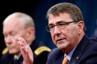 Defense Secretary Ash Carter, right, accompanied by Joint Chiefs Gen. Martin Dempsey, speaks during a news conference at the Pentagon, Thursday, April 16, 2015. (AP Photo/Andrew Harnik)