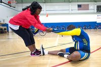 Ida Malone helps her husband, Navy Chief Petty Officer Averill Malone, stretch before cycling during the Navy’s training camp for the 2015 DoD Warrior Games at Ventura County Naval Station Port Hueneme, June 3, 2015. DoD photo by EJ Hersom