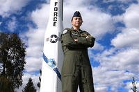 Air Force 2nd Lt. Angie Phillips, 490th Missile Squadron deputy missile combat crew commander, stands in front a Minuteman I missile Sept. 18, 2015, in Lewistown, Mont. (U.S. Air Force/Chris Willis)