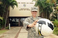 First Lt. Charity Borg, poses with her soccer ball at Joint Base Pearl Harbor-Hickam, Hawaii, after returning from the Royal Air Force's AIRCOM Indoor Football Championship in the United Kingdom, Nov. 30, 2015. (Photo: Tech. Sgt. Amanda Dick)