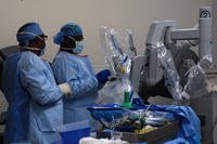 Surgical technicians prepare the da Vinci surgical system for a patient before a laparoscopic surgical procedure at Womack Army Medical Center, Aug. 12, 2015. (Photo: Eve Meinhardt)