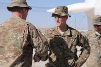 Then Brig. Gen. Richard Clarke, the 82nd Airborne Division commanding general, greets a Soldier during a capabilities display on Kandahar Airfield, Afghanistan, Oct. 24, 2014. (U.S. Army photo/Staff Sgt. John Etheridge)