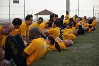 Sailors assigned to Fleet and Industrial Supply Center Yokosuka perform curl-ups during a command Physical Fitness Assessment (PFA) at Fleet Activities Yokosuka, May 7, 2010. (U.S. Navy photo/Mass Communication Specialist 3rd Class Dominique Pineiro)