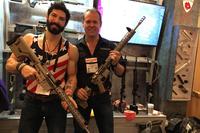 Rudy Reyes left and Walt Hasser right show off Devil Dog arms rifles. (Photo: Military.com/Hope Seck)