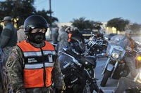 A Soldier with the 3rd Armored Brigade Combat Team, 1st Cavalry Division, prepares on Fort Hood, Texas, to ride his motorcycle to the William R. Courtney Texas State Veterans Home in Temple, Texas, Dec. 18, 2015. (U.S. Army/Sgt. Brandon Banzhaf)