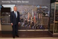 Former Secretary of Defense Chuck Hagel stands next to his quote in a hallway dedicated to veterans of the Vietnam War at the Pentagon in Washington, D.C., Dec. 20, 2016.  (DoD Photo/Staff Sgt. Jette Carr)