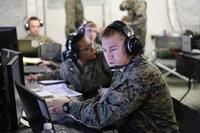 First Lt. Aaron Smith uses a computer during a Marine Air Command and Control System Integrated Exercise at Marine Corps Air Station Cherry Point N.C., Feb. 3, 2015. (Photo By: Cpl. Grace L. Waladkewics)