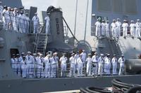 Sailors man the rails of a guided missile cruiser as it returns to Norfolk Naval Base in Norfolk, Va. (U.S. Navy/Specialist Melissa D. Redinger/Released)