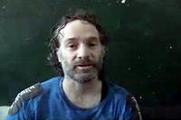 This image made from undated video obtained by The Associated Press, which has been authenticated based on its contents and other AP reporting, shows a man believed to be Peter Theo Curtis, a U.S. citizen held hostage by an al-Qaida linked group in Syria.