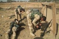 Iraqi soldiers assigned to the 71st Iraqi Army Brigade don their protective masks during patrol scenario at Camp Taji, Iraq, Oct. 15, 2015. (U.S. Army photo by William Marlow)