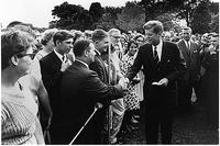 President Kennedy greets Peace Corps workers in 1961. Junger argues that mandatory national service with military and non-military options could build a more cohesive society. (White House photo/Abbie Rowe)