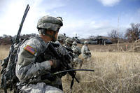 Soldiers of the California National Guard's 40th Infantry Division rehearse an air assault mission at Fort Hunter Liggett in February 2014. (Benjamin Cossel/California National Guard)