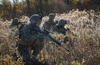 Marines move through brush Fort Drum