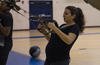 U.S. Air Force Senior Airman Alexandra Singer performs a TRX row exercise at Joint Base Langley-Eustis, Virginia.