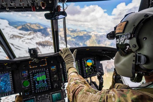 Chief Warrant Officer 2 Bill Powers flies his Chinook through the Bavarian Alps.