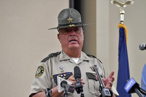 Laurel County sheriff John Root gives an update at the London Community Center in London, Ky.