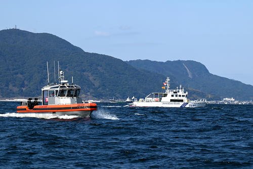 The crew aboard the U.S. Coast Guard Cutter Kimball’s 35-foot, long-range interceptor small boat prepares to conduct a joint search-and-rescue exercise in Kagoshima Bay, Japan, with a Japan Coast Guard AgustaWestland AW139 helicopter aircrew.