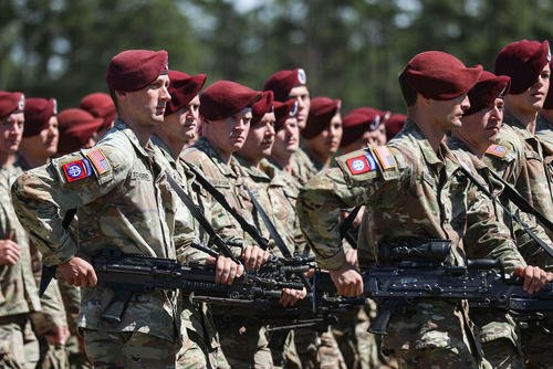 Paratroopers assigned to the 82nd Airborne Division march in formation