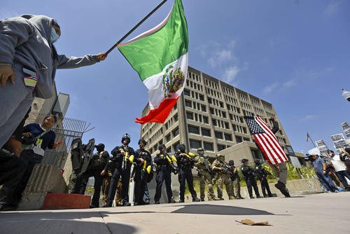 Police stand guard in Santa Ana, Calif.