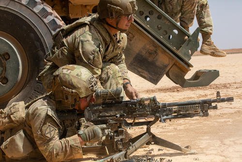 U.S. Army Infantrymen operate an M240B