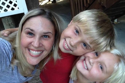 Heather Sweeney and her 2 children are outside the apartment they moved into after her divorce.