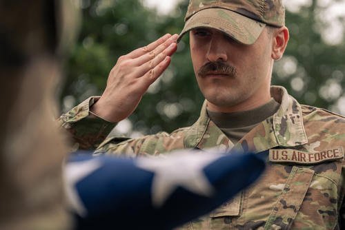 U.S. Air Force Senior Airman Judah Rice, a honor guardsman assigned to the 628th Air Base Wing, gives a facing movement command during military honors simulation for an active-duty funeral, Joint Base Charleston, South Carolina.