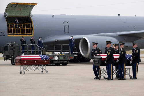 The remains of Staff Sgt. Edgar Brian Torres-Tovar and Staff Sgt. William Nathaniel Howard are moved during a dignified transfer at the Des Moines International Airport.